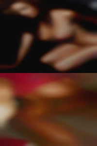 FFM woman in swinger clubs bed.